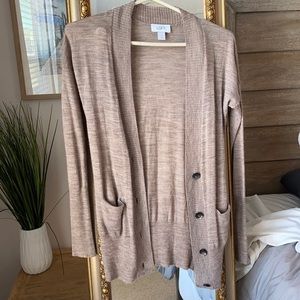Button down waist length sweater.
